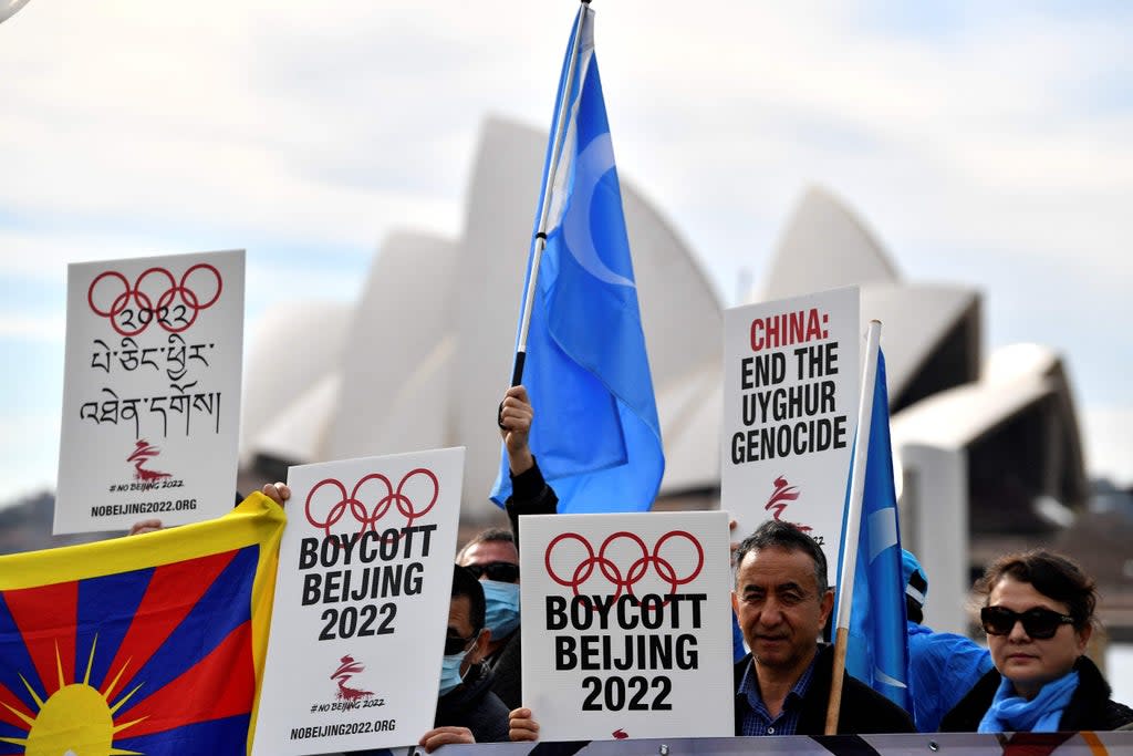 Protesters urging Australian government to boycott the Games at a demonstration in June  (AFP via Getty Images)