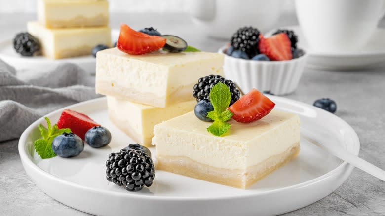 Square vanilla cheesecake with fruit topping
