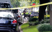 <p>Police investigate the car believed to belong to the alleged shooter at the scene of a shooting along Wesleyan at Law Street in Houston that left multiple people injured and the alleged shooter dead, Monday morning, Sept. 26, 2016, in Houston. (Mark Mulligan/Houston Chronicle via AP) </p>