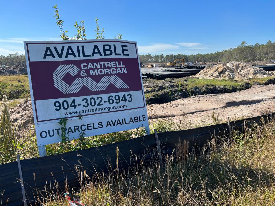 A sign advertising available outparcels can be seen on the site a new shopping center called Cornerstone at Seminole Woods under construction along the south side of State Highway 100 East in Palm Coast, across the street from Tom Gibbs Chevrolet, on Tuesday, Nov. 7, 2023.