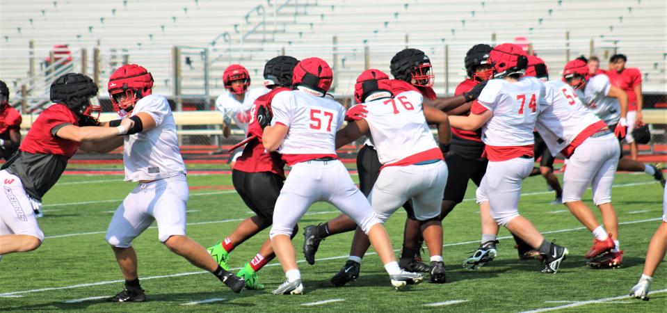 The Firebirds run a play. Lakota West High School football practice, August 2, 2023.