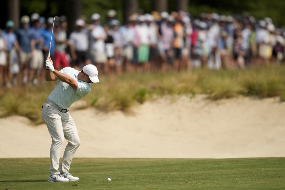 Rory McIlroy, of Northern Ireland, hits from the fairway on the 10th hole during the final round of the U.S. Open golf tournament Sunday, June 16, 2024, in Pinehurst, N.C. (AP Photo/Matt York)