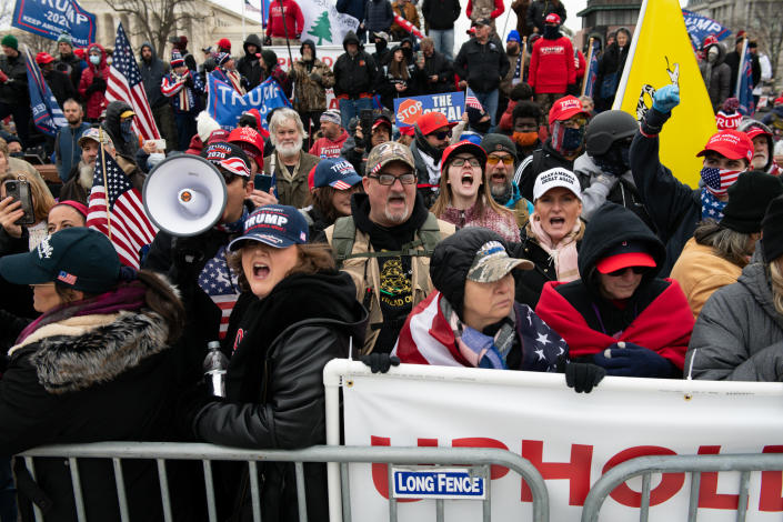 Demonstrators gather during a protest outside of the U.S. Capitol building in Washington, D.C. on Wednesday. (Graeme Sloan/Bloomberg via Getty Images)