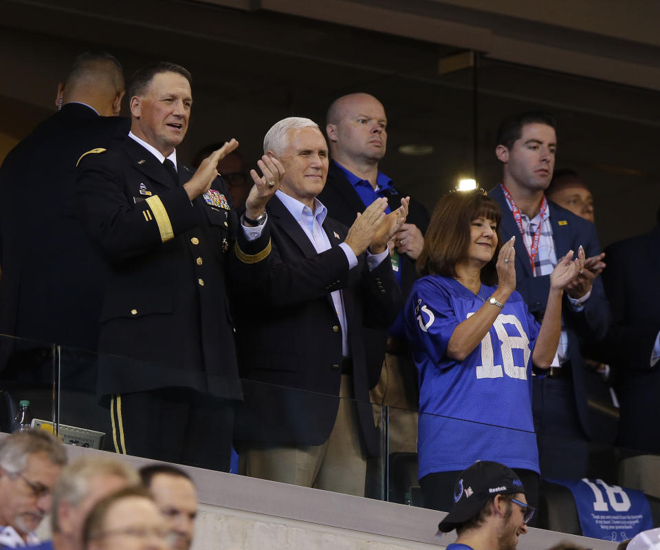 Vice President Mike Pence applauds before an NFL football game