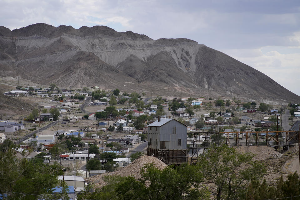 FILE - Homes sit on a hillside on July 18, 2022, in Tonopah, Nev., the county seat of Nye County. The rural Nevada county’s plan to hand-count all paper ballots alongside a machine tabulation process is coming under renewed scrutiny just days before the hand-count is set to begin on Wednesday, Oct. 26, 2022. (AP Photo/John Locher, File)