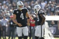 Sep 17, 2017; Oakland, CA, USA; Oakland Raiders quarterback Derek Carr (4) reacts after being called for a false start against the New York Jets in the fourth quarter at Oakland Coliseum. Cary Edmondson-USA TODAY Sports