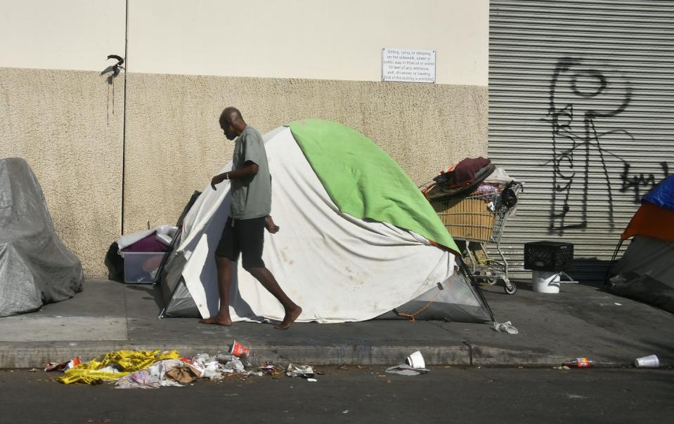 Tents house the homeless on a street in Los Angeles. (Photo: Frederic J. Brown/Getty Images)