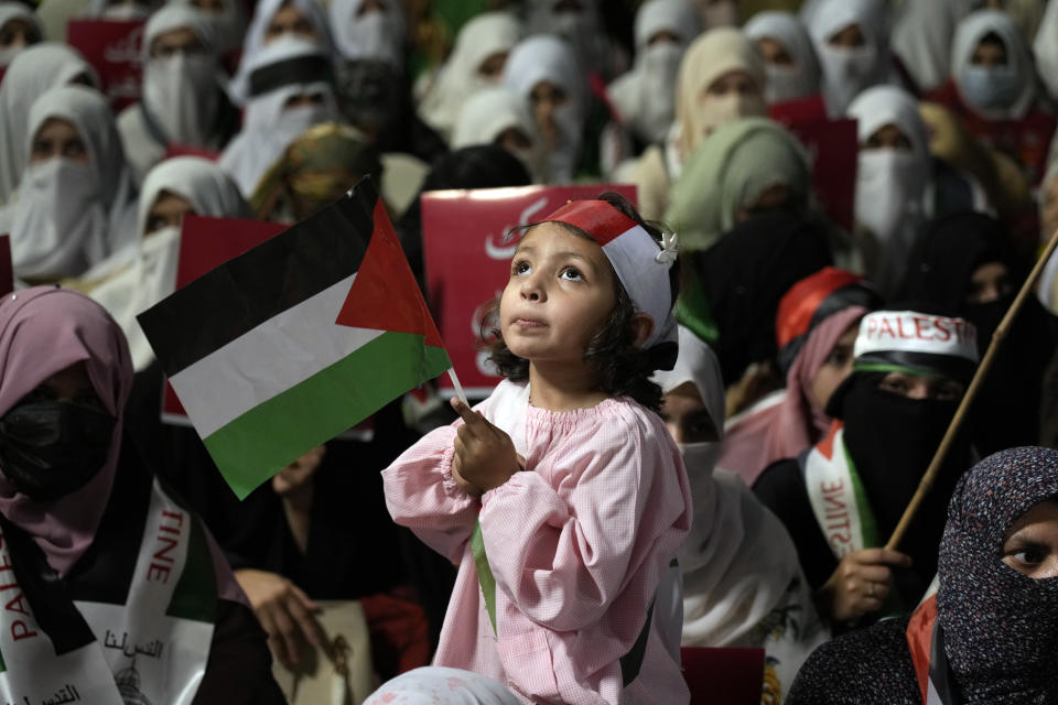 Supporters of the religious party Jamaat-e-Islami take part in a rally against Israeli airstrikes on Gaza and to show solidarity with the Palestinians, in Lahore, Pakistan, Saturday, April 20, 2024. (AP Photo/K.M. Chaudary)