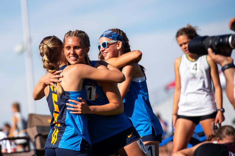 Timnath girls relay runners embrace after winning the 2A 4x800 event during the Colorado track & field state championships on Thursday, May 16, 2024 at Jeffco Stadium in Lakewood, Colo.