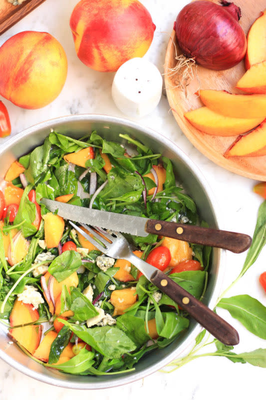 <p>Dish by Dish</p><p>This is a colorful, vibrant summer salad that’s bursting with contrasting flavors.</p><p><strong>Get the recipe: <a href="https://www.dishbydish.net/peach-arugula-tomato-salad-with-honey-olive-oil-dressing/" rel="nofollow noopener" target="_blank" data-ylk="slk:Peach, Arugula and Tomato Salad with Honey Olive Oil Dressing;elm:context_link;itc:0;sec:content-canvas" class="link rapid-noclick-resp"><em>Peach, Arugula and Tomato Salad with Honey Olive Oil Dressing</em></a></strong></p>
