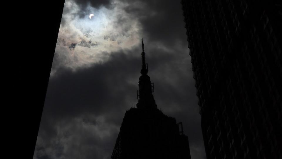 <div>The sun is eclipsed by the moon over top of the Empire State Building in New York City on August 21, 2017. (Photo by Gary Hershorn/Getty Images)</div>