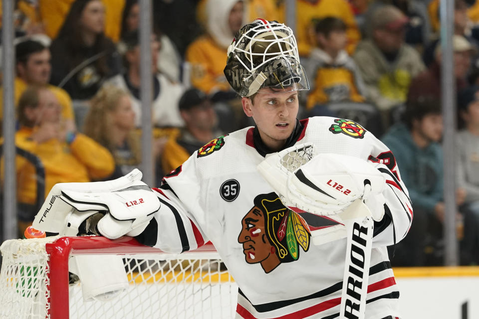 Chicago Blackhawks goaltender Kevin Lankinen takes a break in the second period of an NHL hockey game against the Nashville Predators Saturday, April 16, 2022, in Nashville, Tenn. (AP Photo/Mark Humphrey)