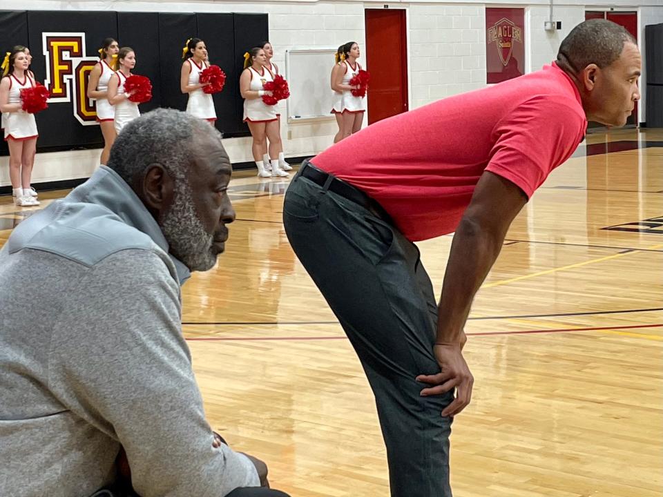 Former NBA star Cazzie Russell (left) is a special assistant to Flagler College women's basketball coach Maurice Smith (right).