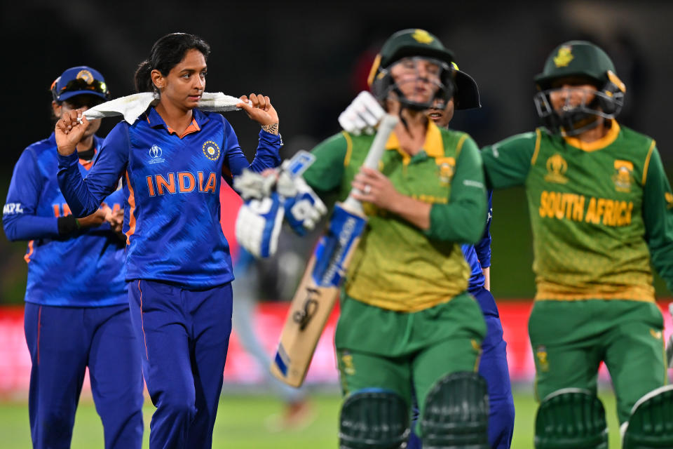 India look dejected after being knocked out during the 2022 ICC Women's Cricket World Cup match against South Africa.