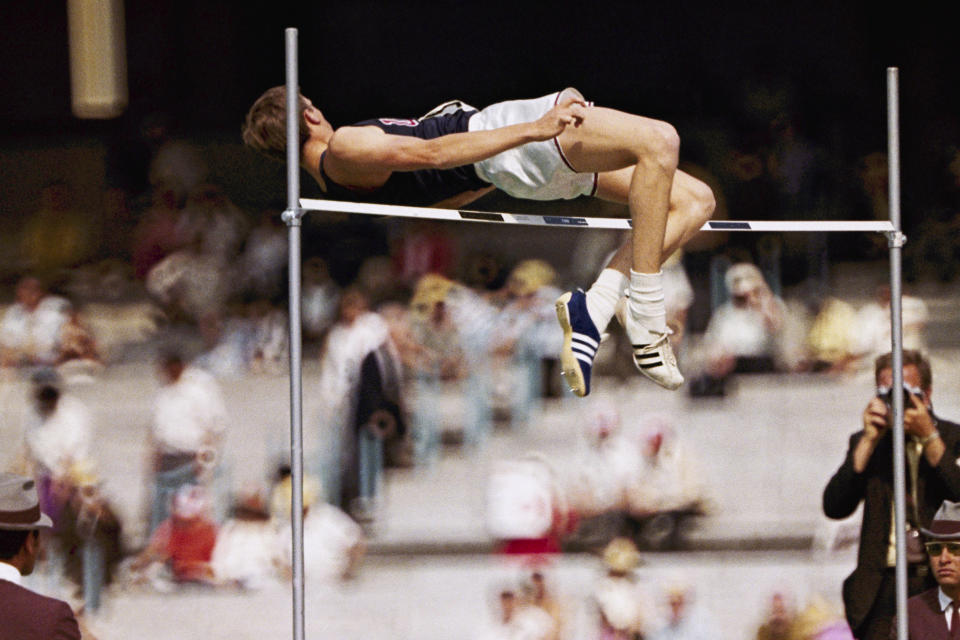 FILE - In this 1968 file photo, Dick Fosbury, of the United States, clears the bar in the high jump competition at the 1968 Mexico City Olympics. Fosbury is celebrated for the "Fosbury Flop," which revolutionized high-jumping. As he clears the bar he twists his body so that he goes over the bar head first which his back to the bar. The Mexico City audience was captivated by Fosbury and shouted, "Ole" as he cleared the bar. (AP Photo/File)