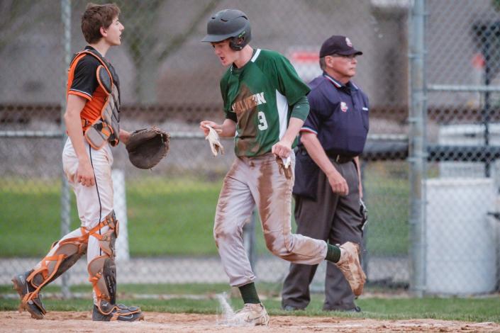 Malvern&#39;s Dylan Phillips scores on an RBI hit during the game against Strasburg Monday night.
