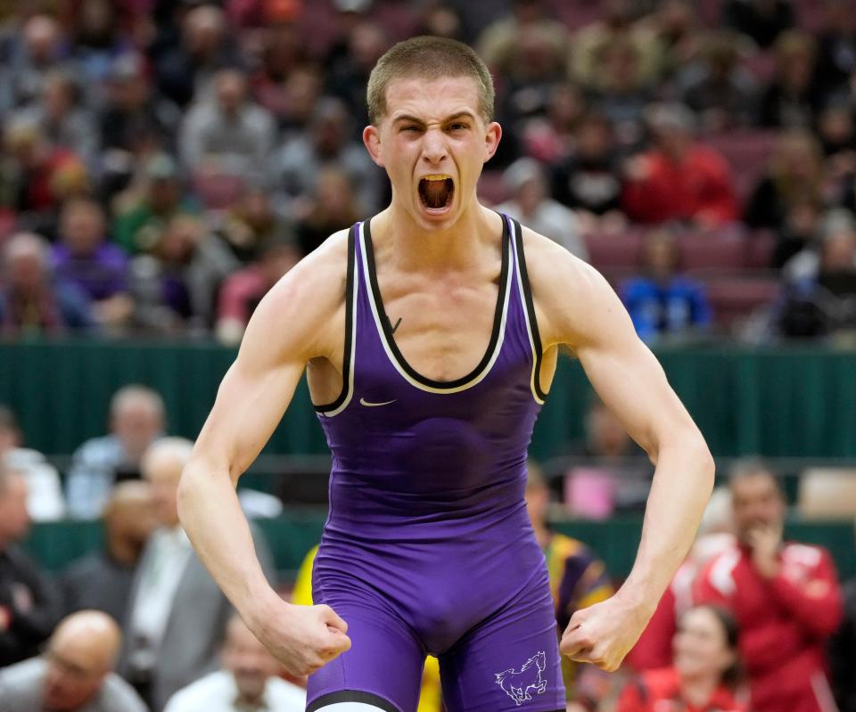 March 12, 2023; Columbus, Ohio, USA; 
David McClelland of DeSales celebrates after beating Hayden Hughes of Graham at 138 lbs. in Division II during the finals of the OHSAA state wrestling tournament. 
Mandatory Credit: Barbara J. Perenic/Columbus Dispatch