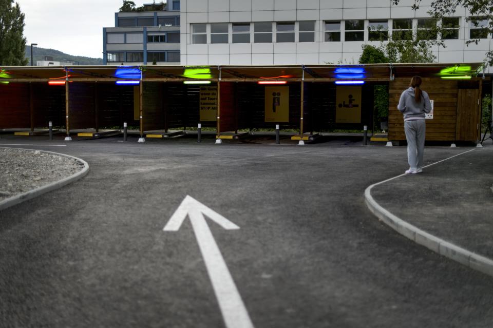 A prostitute faces “sex boxes” in Zurich on the opening day of Switzerland’s first sex drive-in, Aug. 26, 2013. (Photo: Fabrice Coffrini/AFP/Getty Images)