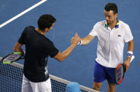 Tennis - Australian Open - Melbourne Park, Melbourne, Australia - 23/1/17 Canada's Milos Raonic shakes hands after winning his Men's singles fourth round match against Spain's Roberto Bautista Agut. REUTERS/Issei Kato