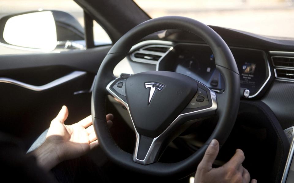 The Autopilot software, launched by Tesla in 2015, has features like automatic cruise control, lane guidance and automatic braking - Beck Diefenbach/Reuters