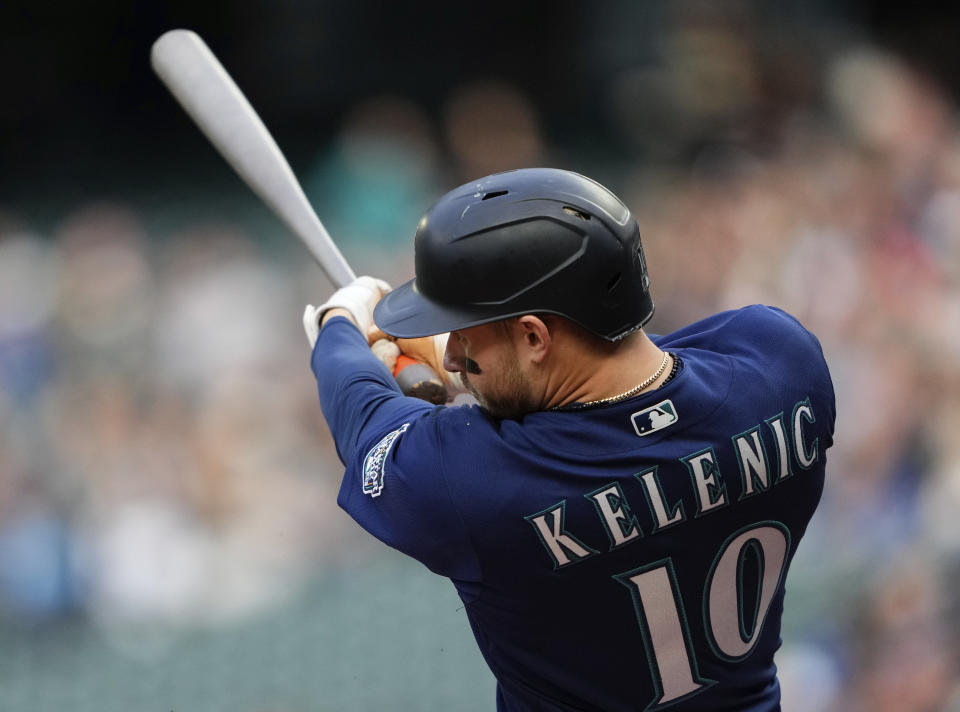 Seattle Mariners' Jarred Kelenic follows through on a two-run home run against the Oakland Athletics during the first inning of a baseball game Monday, May 22, 2023, in Seattle. (AP Photo/Lindsey Wasson)