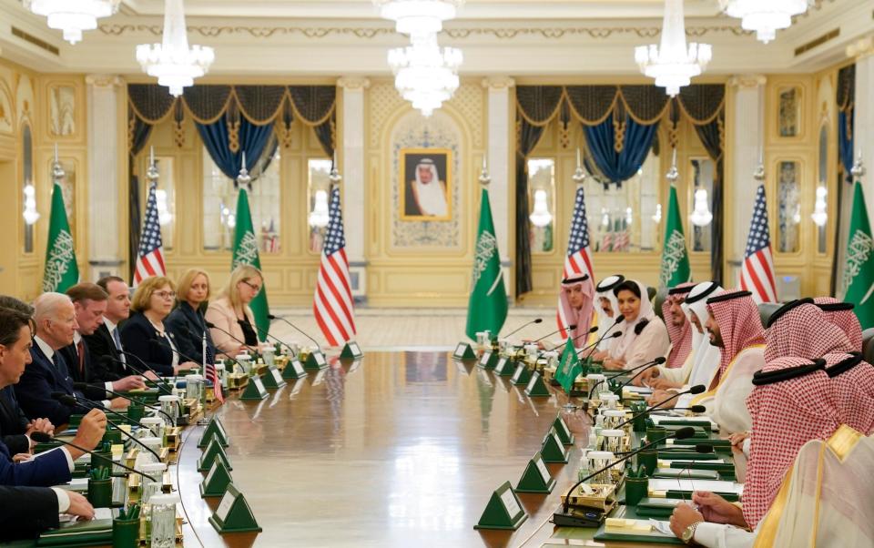 Joe Biden and his team (left) participate in a working session with Saudi Crown Prince Mohammed bin Salman team at the Al Salman Royal Palace - AP