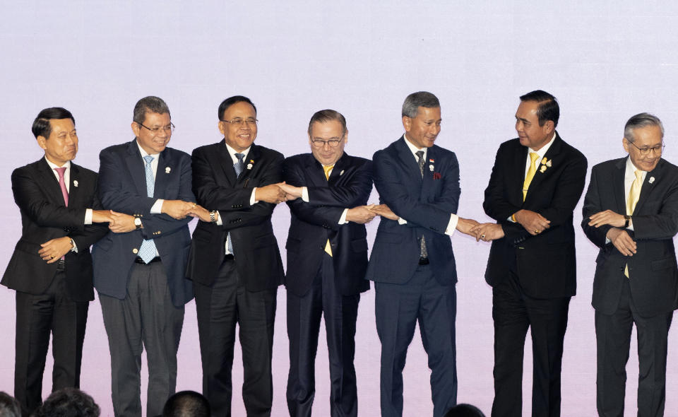 FILE - In this July 31, 2019, file photo, foreign ministers of the Association of Southeast Asian Nations prepare to pose for a group photo during the opening ceremony of their meeting in Bangkok, Thailand. In a report released Wednesday, Sept. 25, 2019, the Asian Development Bank says that escalating trade tensions will sap Asian economies of some of their potential in this year and the next. (AP Photo/Gemunu Amarasinghe, File)