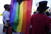 People protest outside the Netflix building on Vine Street in the Hollywood section of Los Angeles, Wednesday, Oct. 20, 2021. Critics and supporters of Dave Chappelle's Netflix special and its anti-transgender comments gathered outside the company's offices Wednesday, Oct. 20, 2021, with "Trans Lives Matter" and "Free Speech is a Right" among their competing messages. (AP Photo/Damian Dovarganes)