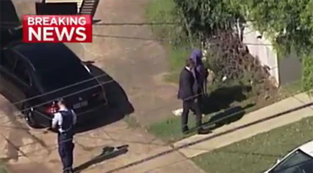 A woman at the Guildford West scene with police officers. Source: 7 News