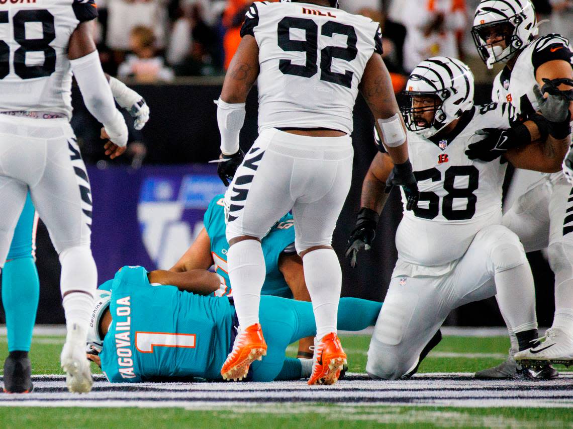 Miami Dolphins quarterback Tua Tagovailoa (1) hits ground after sack by Bengals’ Josh Tupou (68) during second quarter on Thursday, September 29, 2022 in Cincinnati. Tagovailao left game, was briefly hospitalized, and is now under NFL concussion protocols.