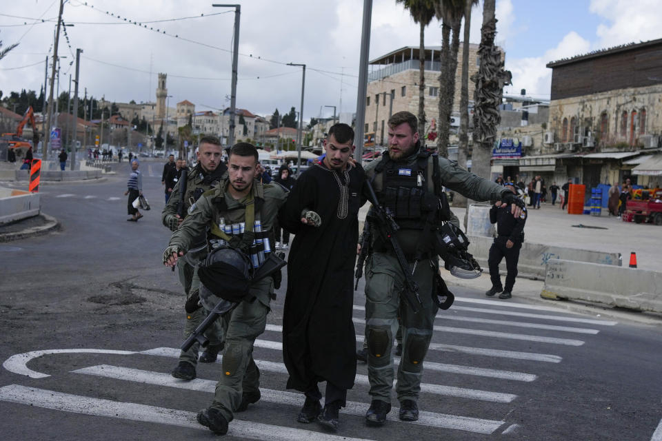 Israeli security forces detain a Palestinian man during the Muslim holy month of Ramadan just outside Jerusalem's Old City, Friday, March 15, 2024. (AP Photo/Maya Alleruzzo)