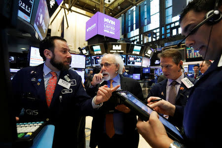 Traders work on the floor of the New York Stock Exchange (NYSE) in New York, U.S., March 6, 2017. REUTERS/Brendan McDermid