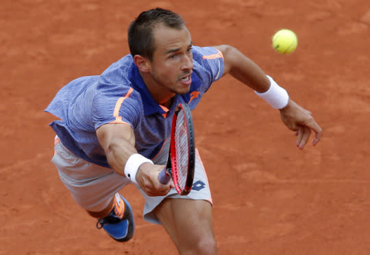 <p>The Czech Republic’s Lukas Rosol returns the ball to the defending champion, Switzerland’s Stan Wawrinka, during their first-round match at the French Open on May 23, 2016, in Paris. (Christophe Ena/AP) </p>