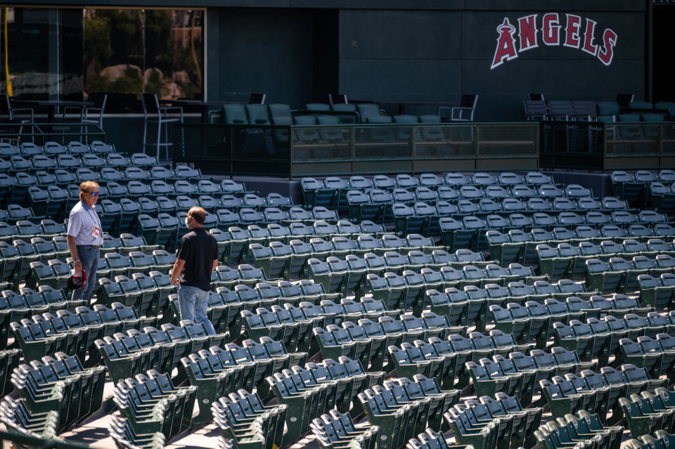 Angels general manager Billy Eppler, right, speaks with Hall of Fame manager Tony La Russa at Angel Stadium.