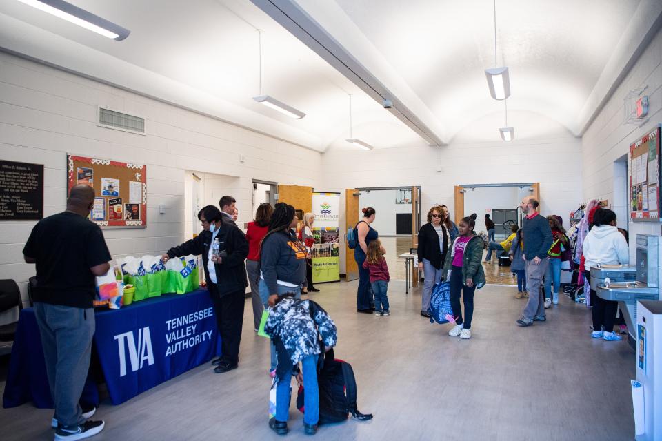 People gather in the lobby area of the newly renovated Milton S. Roberts Community Center on Asheville Highway.