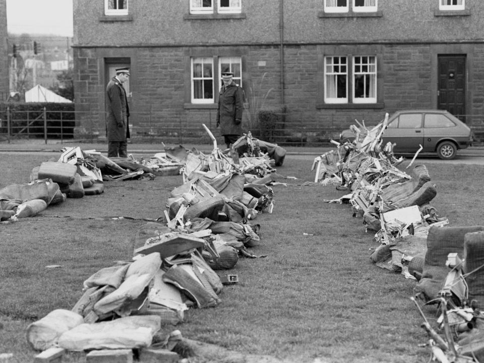 Police officers view the sorry sight of a row of aircraft seats from the crashed Pan Am Boeing 103. The plane came down on the town of Lockerbie, killing all 258 on board and 17 people on the ground.