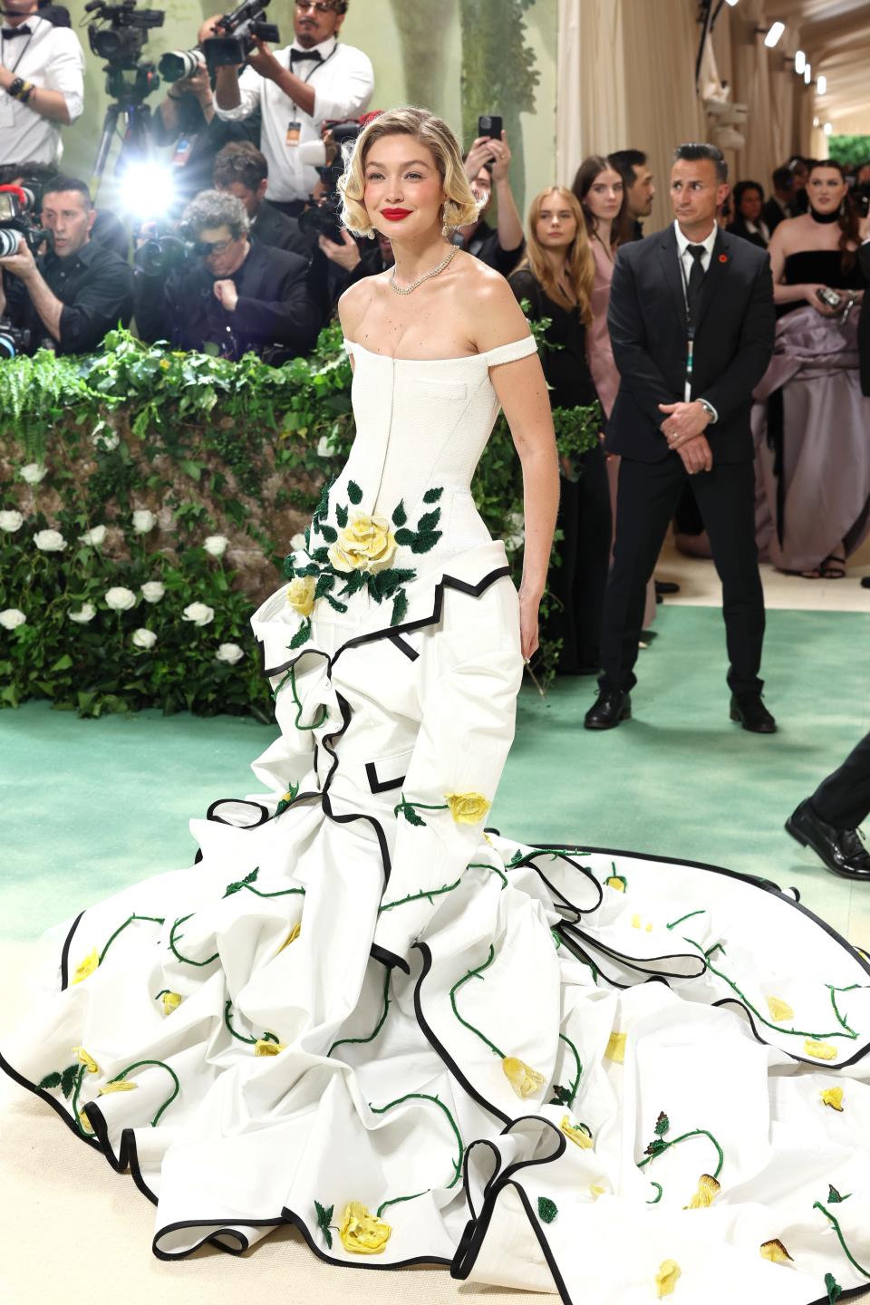Gigi Hadid radiated in a floor-length white gown by Thom Browne.