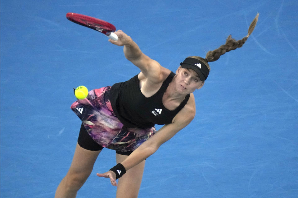 Elena Rybakina of Kazakhstan serves to Victoria Azarenka of Belarus during their semifinal match at the Australian Open tennis championship in Melbourne, Australia, Thursday, Jan. 26, 2023. (AP Photo/Dita Alangkara)