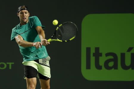 Mar 29, 2017; Miami, FL, USA; Jack Sock of the United States hits a backhand against Rafael Nadal of Spain (not pictured) on day nine of the 2017 Miami Open at Crandon Park Tennis Center. Nadal won 6-2, 6-3. Mandatory Credit: Geoff Burke-USA TODAY Sports