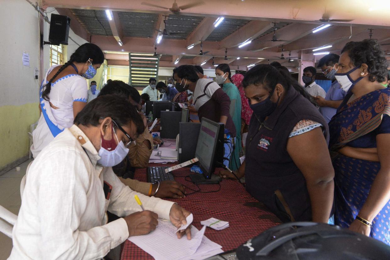 People lineup to register to receive a dose of a Covid-19 vaccine during an inoculation drive in Hyderabad, India, on 16 June, 2021. The first case of ‘green fungus’ has been found in a Covid-19 recovered patient in Madhya Pradesh (AFP via Getty Images)