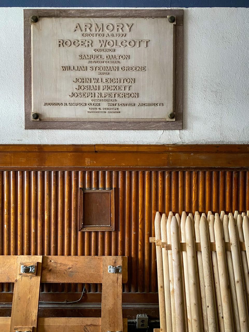 A plaque in the lobby of the Bank Street Armory commemorates the building's construction, seen on Wednesday during a tour of the property.