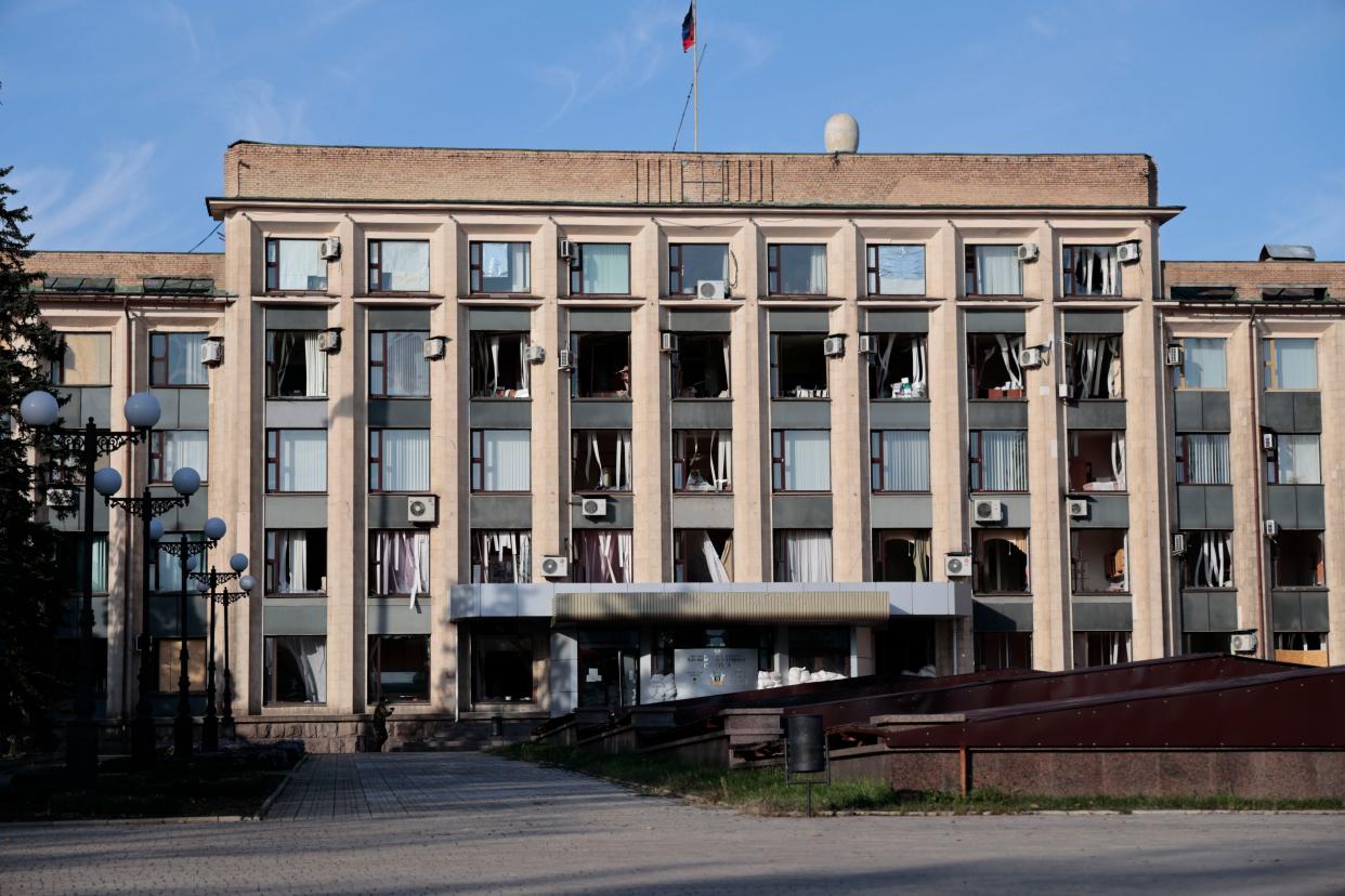 A view of a damaged administrative building after shelling in Donetsk, the capital of Donetsk People's Republic, eastern in Ukraine, Sunday, Oct. 16, 2022. (AP Photo/Alexei Alexandrov)