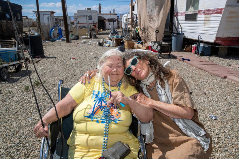Sun Shine, left, local resident and model in Brenda Ann Kenneally's upcoming Bombay Beach Fashion Show, in Bombay Beach, Calif., on March 19, 2024.
