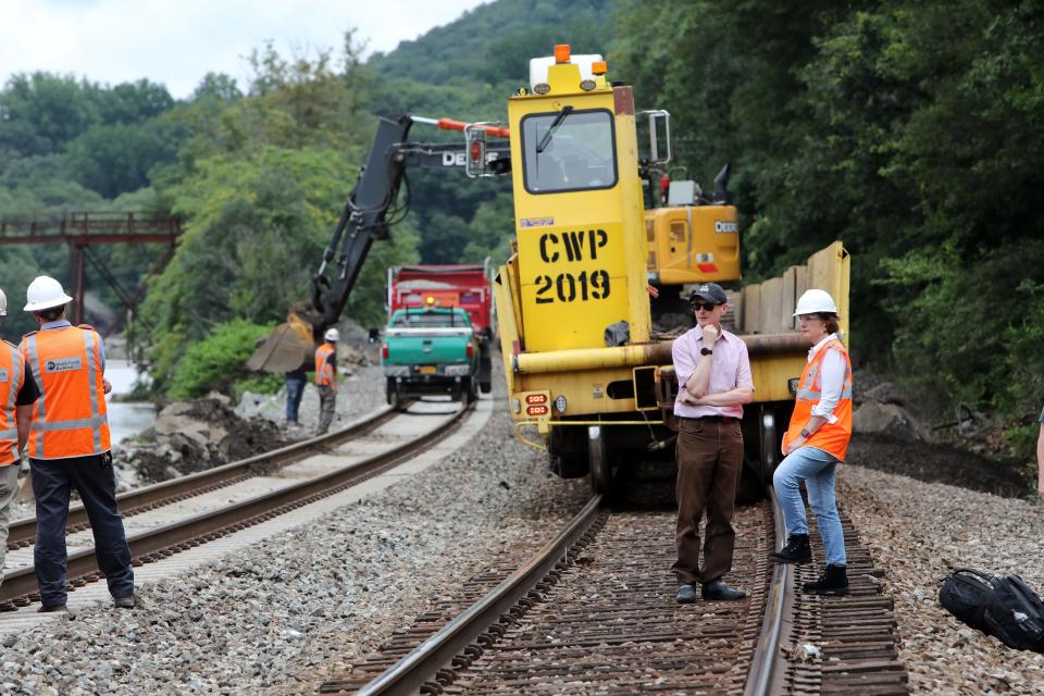 MTA Metro-North Railroad President Catherine Rinaldi, right, speaks with Spokesperson Aaron Donovan after surveying the previous day's storm damage on the tracks north of the Manitou train station in July 10, 2023 in Philipstown. 