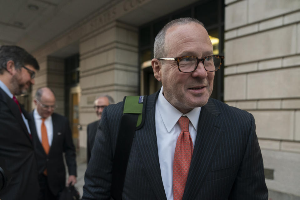 James Lee Bright, together with other attorneys for Oath Keepers leader Stewart Rhodes, leaves the federal courthouse on the first day of the jury selection for Rhodes' trial in Washington, Tuesday, Sept. 27, 2022. (AP Photo/Manuel Balce Ceneta)