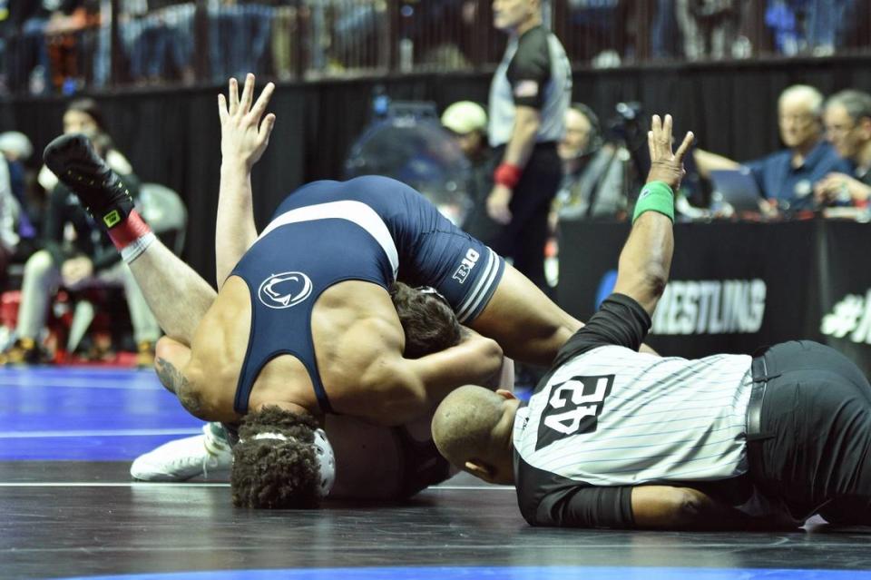 Penn State’s Greg Kerkvliet looks for the pin of Purdue’s Hayden Copass in their 285-pound first round match of the NCAA Championships on Thursday, March 16, 2023 at the BOK Center in Tulsa, Okla. Kerkvliet pinned Copass in 34 seconds.