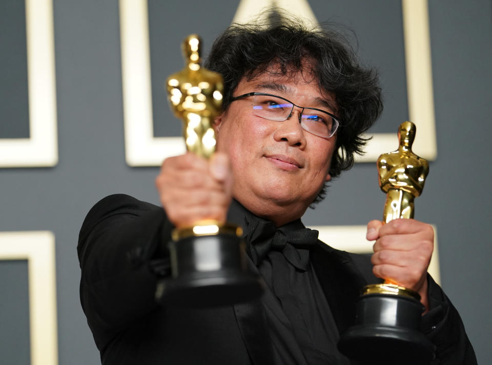 Bong Joon-ho poses with his Oscars at the 2020 ceremony - Credit: Getty Images