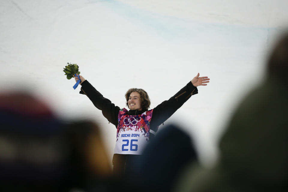 Switzerland's Iouri Podladtchikov celebrates after he won the gold medal in the men's snowboard halfpipe final at the Rosa Khutor Extreme Park, at the 2014 Winter Olympics, Tuesday, Feb. 11, 2014, in Krasnaya Polyana, Russia. (AP Photo/Jae C. Hong)