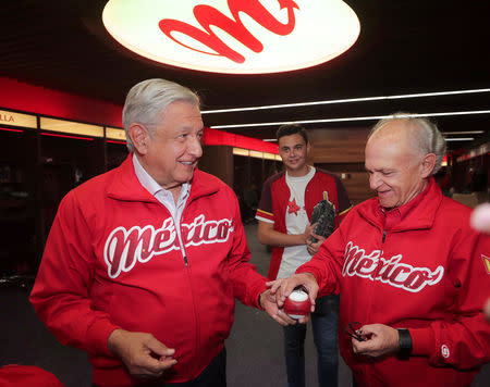 Mexico's President Andres Manuel Lopez Obrador and Diablos Rojos Chairman Alfredo Harp Helu during the opening celebrations of the Alfredo Harp Helu Stadium in Mexico City, Mexico March 23, 2019. Press Office Andres Manuel Lopez Obrador/Handout via REUTERS