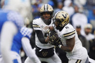 Vanderbilt quarterback Mike Wright (5) hands the ball off to Vanderbilt running back Ray Davis (2) during the second half of an NCAA college football game against Kentucky in Lexington, Ky., Saturday, Nov. 12, 2022. (AP Photo/Michael Clubb)